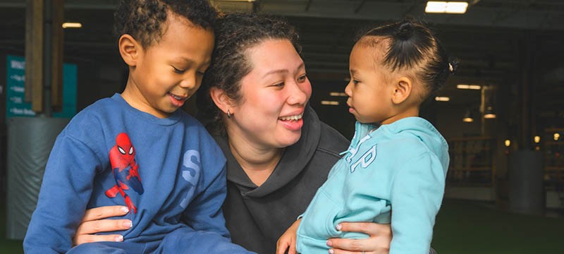 Ypsilanti resident Vahna Paige (center) with her children Ocean Blue (left) and Reign Blue (right). Paige, who is currently pregnant with her third child, is one of Ypsi's first participants in the RxKids cash assistance program for new moms and babies.