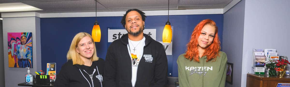 Student Advocacy Center of Michigan (SAC) Co-Executive Directors Peri Stone-Palmquist and Anell Eccleston with SAC board member Diamond Marie.