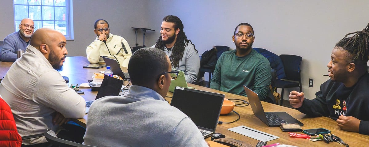 Ambassadors for the Healing Brothers United mental health program meet at Packard Health's Carpenter Road location in Ypsilanti.