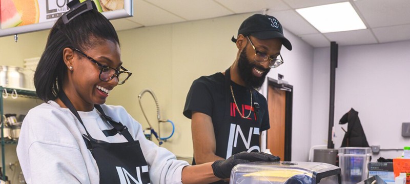 Nashia and Brandon Frye preparing smoothies at No Label Juice.