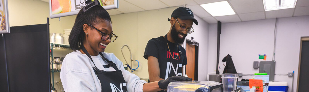 Nashia and Brandon Frye preparing smoothies at No Label Juice.