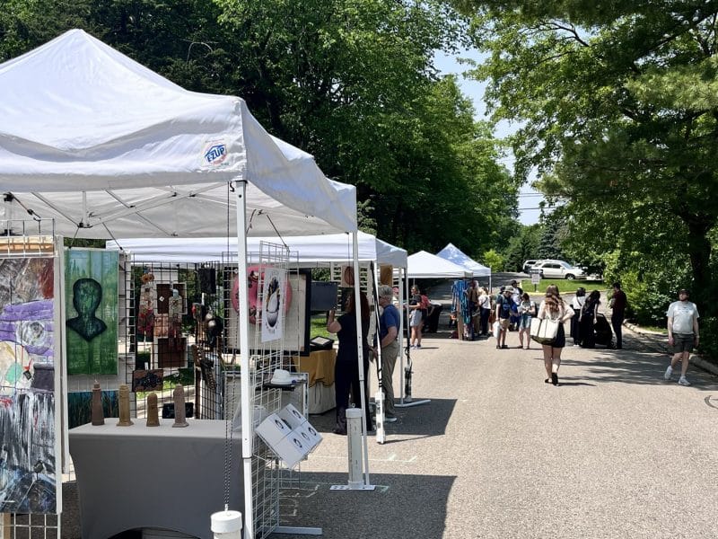 People browse the 2025 Westside Art Hop in Ann Arbor.