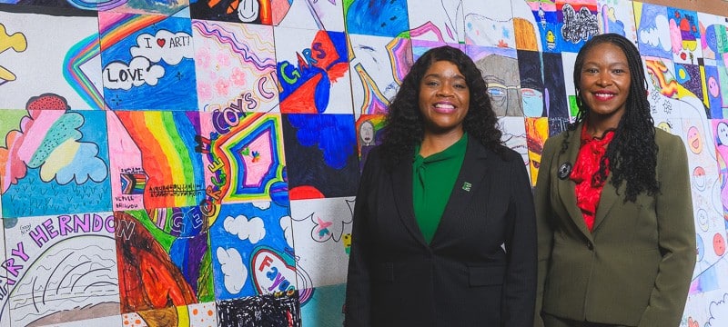 Eastern Michigan University Director of Admissions Dr. LaJoyce Brown and Ypsilanti Community Schools Superintendent Alena Zachery-Ross at Ypsilanti Community High School.
