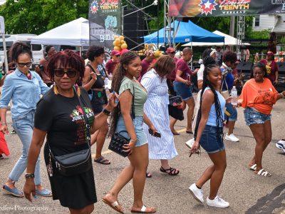 People do the hustle at the 2025 Ypsilanti Juneteenth celebration.