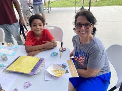 People participate in summer programming at the Ypsilanti District Library.