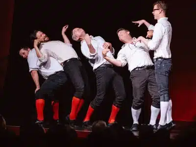 The Improvised Shakespeare Company performs.