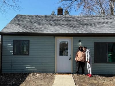 Residents stand outside the first home established for use in Pittsfield Township nonprofit Exceptional Journeys' community living supports program.