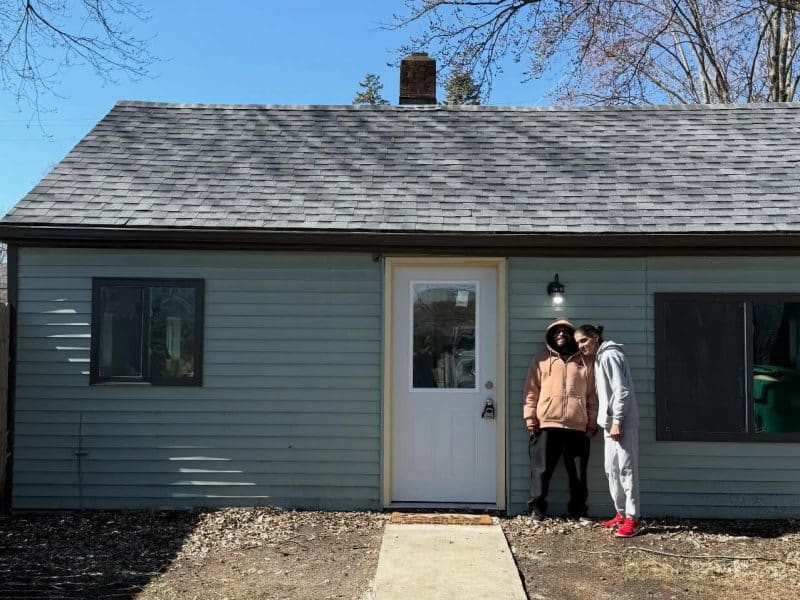 Residents stand outside the first home established for use in Pittsfield Township nonprofit Exceptional Journeys' community living supports program.