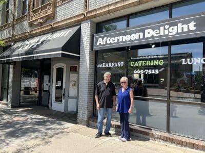 Afternoon Delight founder Tom Hackett and owner Joanne Williams stand outside the popular Ann Arbor restaurant.