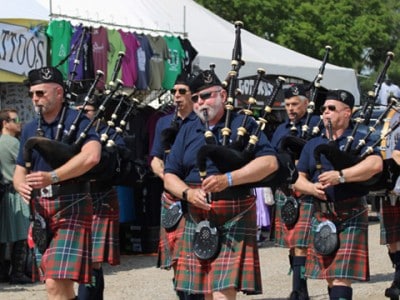 Bagpipers perform in a parade at the Michigan Celtic festival.