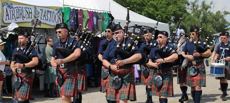 Bagpipers perform in a parade at the Michigan Celtic festival.