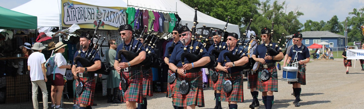 Bagpipers perform in a parade at the Michigan Celtic festival.