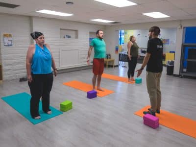 A gentle mat yoga class at the Neighborhood Collaborative in Ypsilanti.