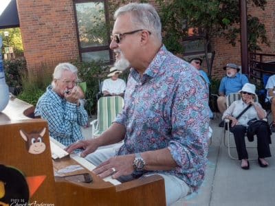 Mark "Mr. B" Braun performs a free piano concert near the Ann Arbor Farmers Market.