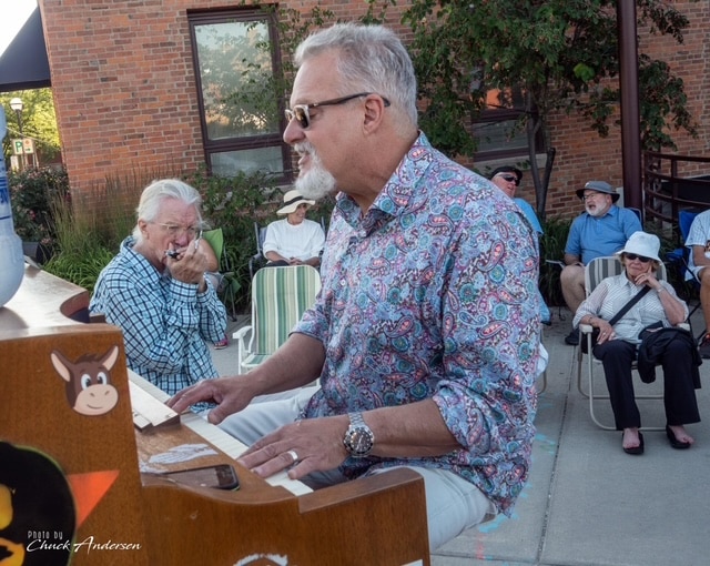 Mark "Mr. B" Braun performs a free piano concert near the Ann Arbor Farmers Market.