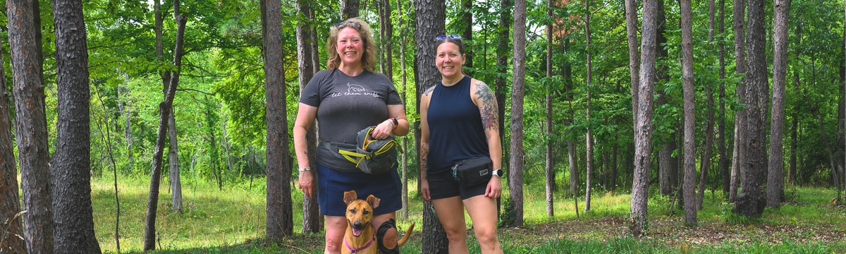 Hannah Ashmore and Sara Samborn with Kenna, a Michigan Conservation Dog trained to sniff out invasive spotted lanternflies.