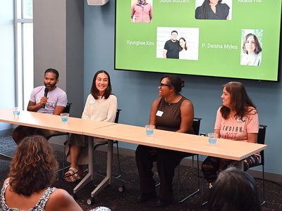 A panel discussion at an opening reception at the Ypsilanti District Library's Superior Branch for the expansion of the Ypsi Farmers & Gardeners Oral History Project. Project interviewees Julius Buzzard, Kyunghee Kim, Akaiia Hill, and P. Deisha Myles are pictured left to right.